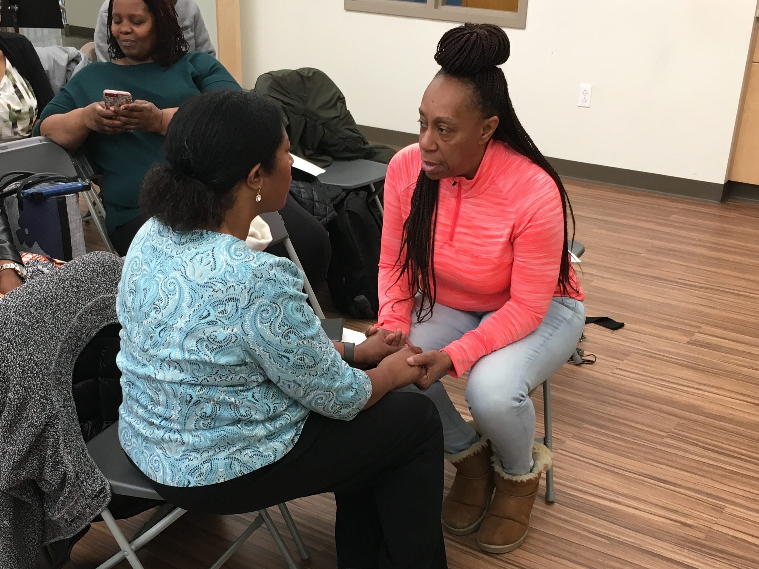 IMG_2634 Two women sitting face to face speaking